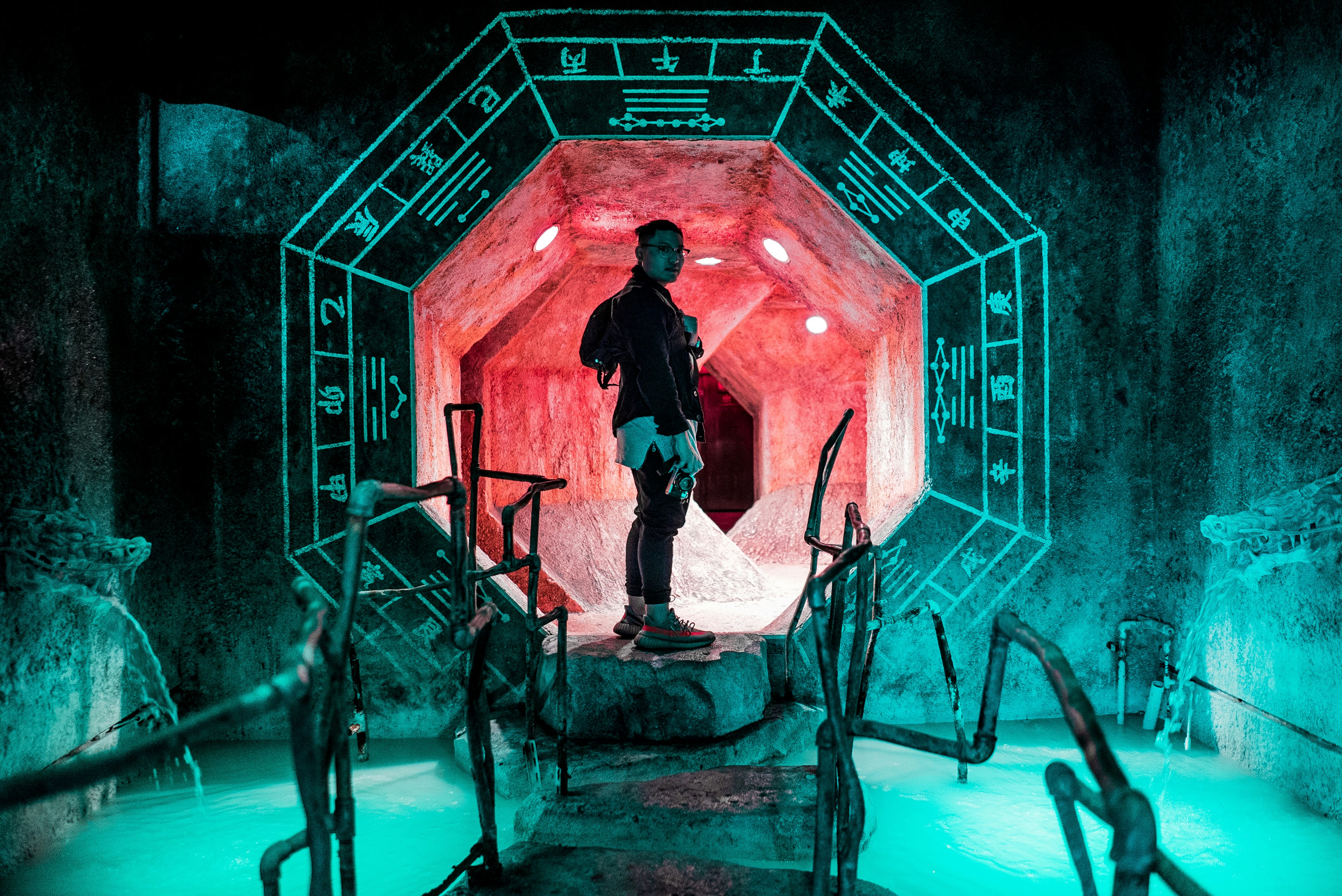 man standing inside tunnel